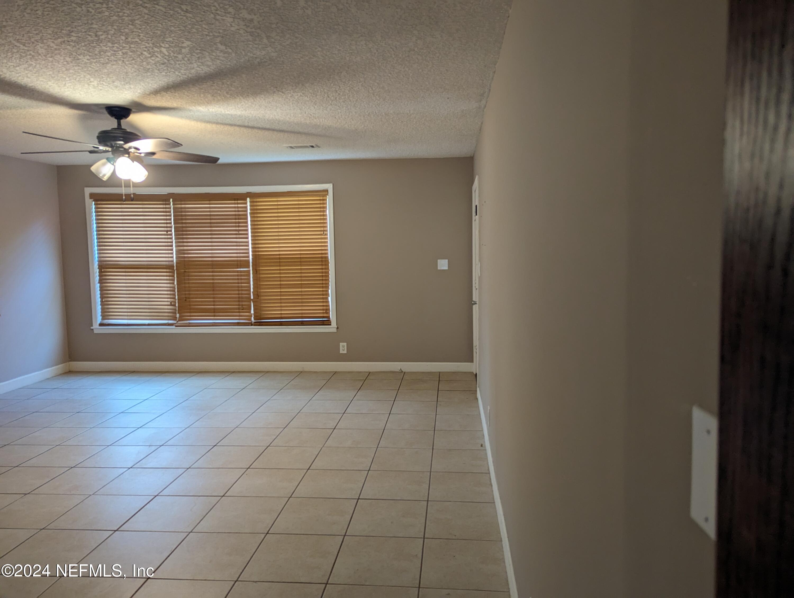 5120 Oakside Drive Jacksonville, FL 32244 - Photo 24 of 24 a view of an empty room with a window