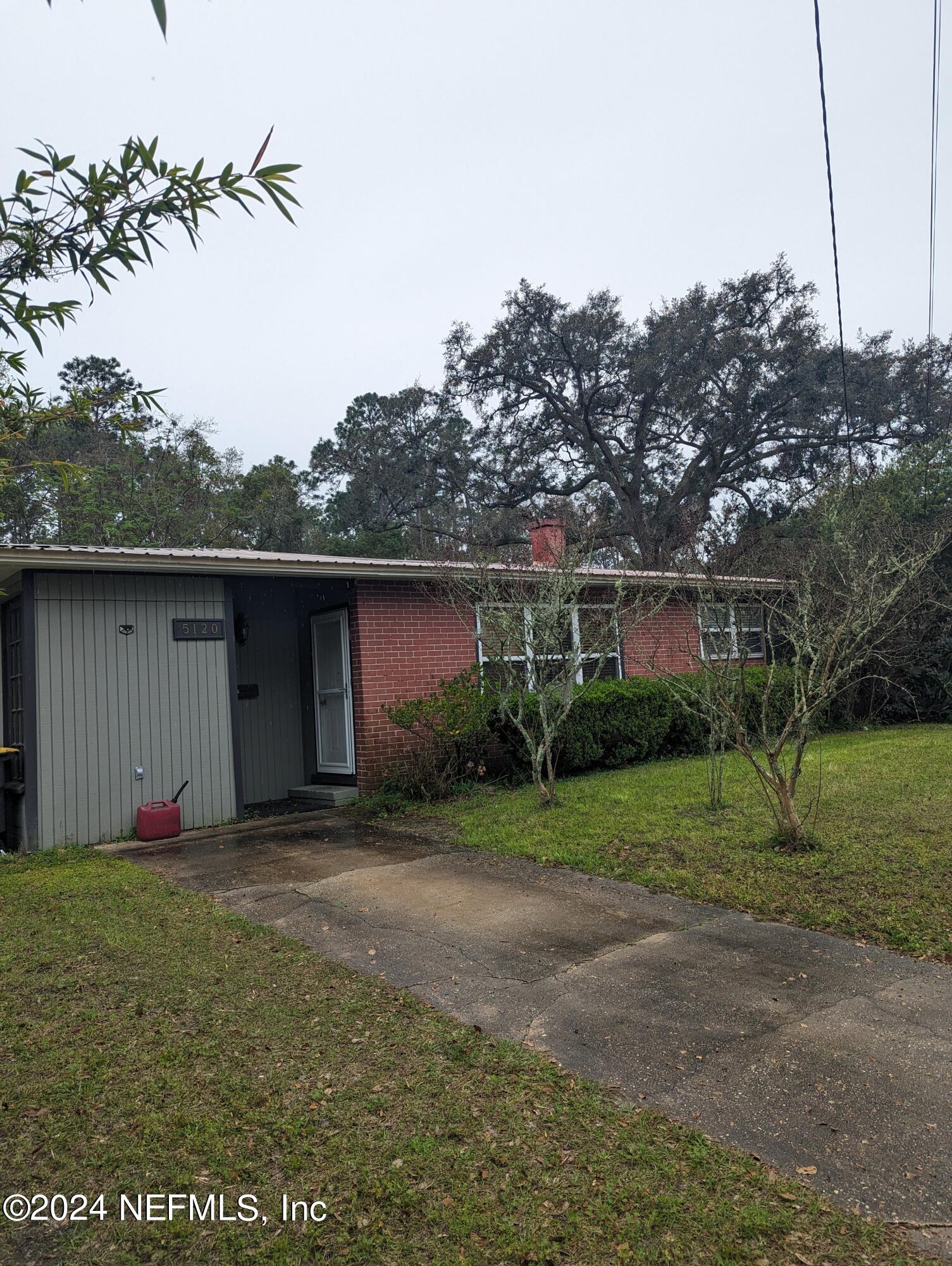 5120 Oakside Drive Jacksonville, FL 32244 - Photo 4 of 24 a view of a house with a yard