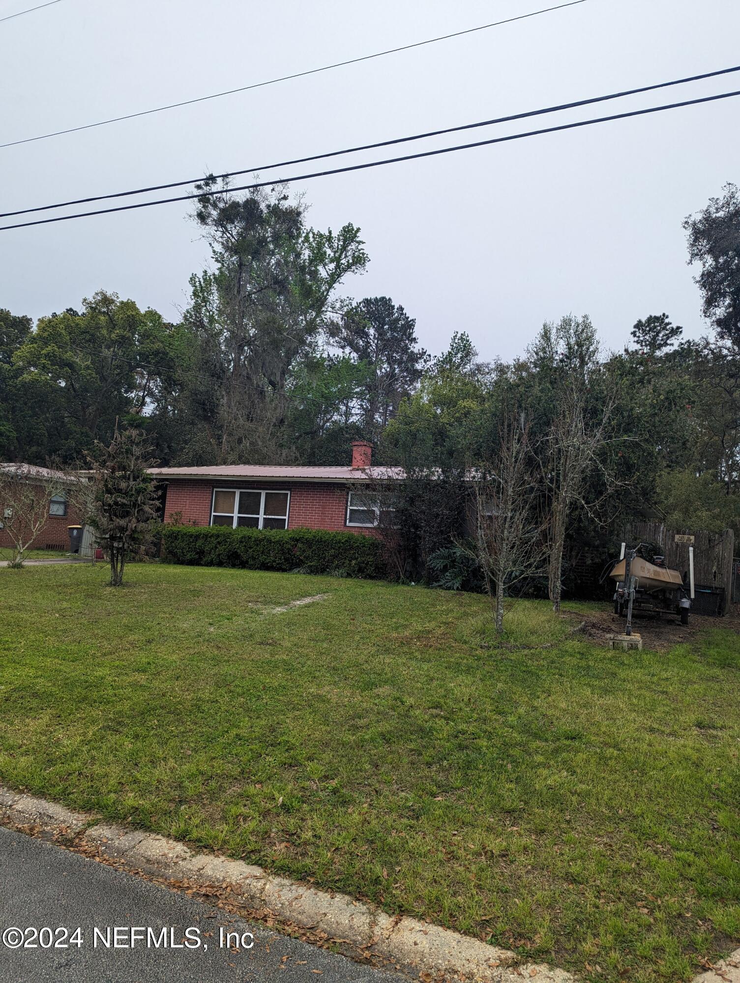 5120 Oakside Drive Jacksonville, FL 32244 - Photo 5 of 24 a view of a house with a backyard