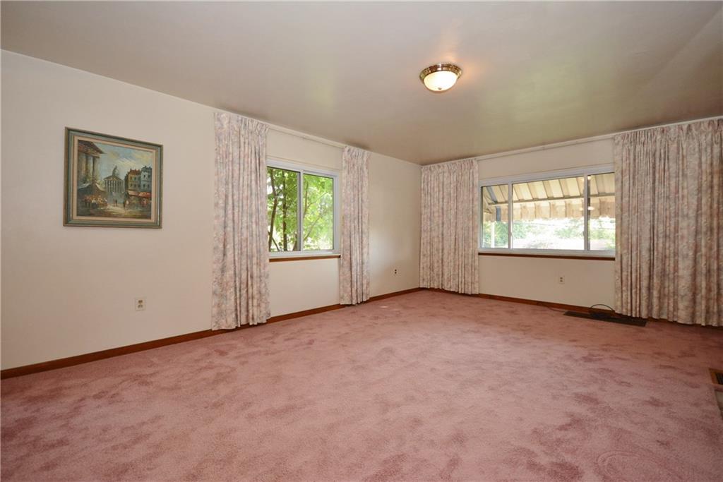 1034 Silver Lane McKees Rocks, PA 15136 - Photo 5 of 25 Another window in the living room faces the side of the property, and allows natural light to flood the space, creating a welcoming environment.