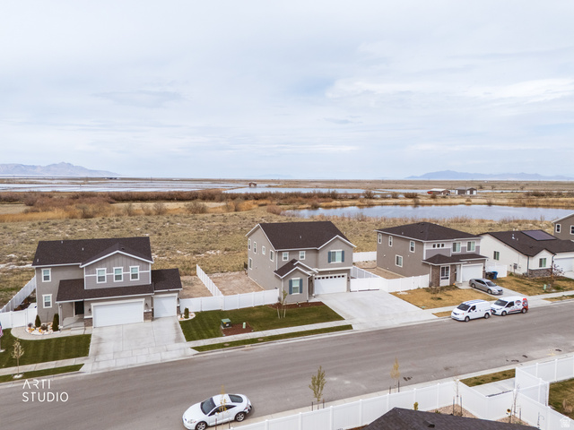540 Lefty Lane Tooele, UT 84074 - Photo 36 of 48 Aerial perspective of suburban area with a water and mountain view