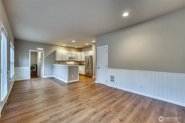 a view of kitchen with wooden floor