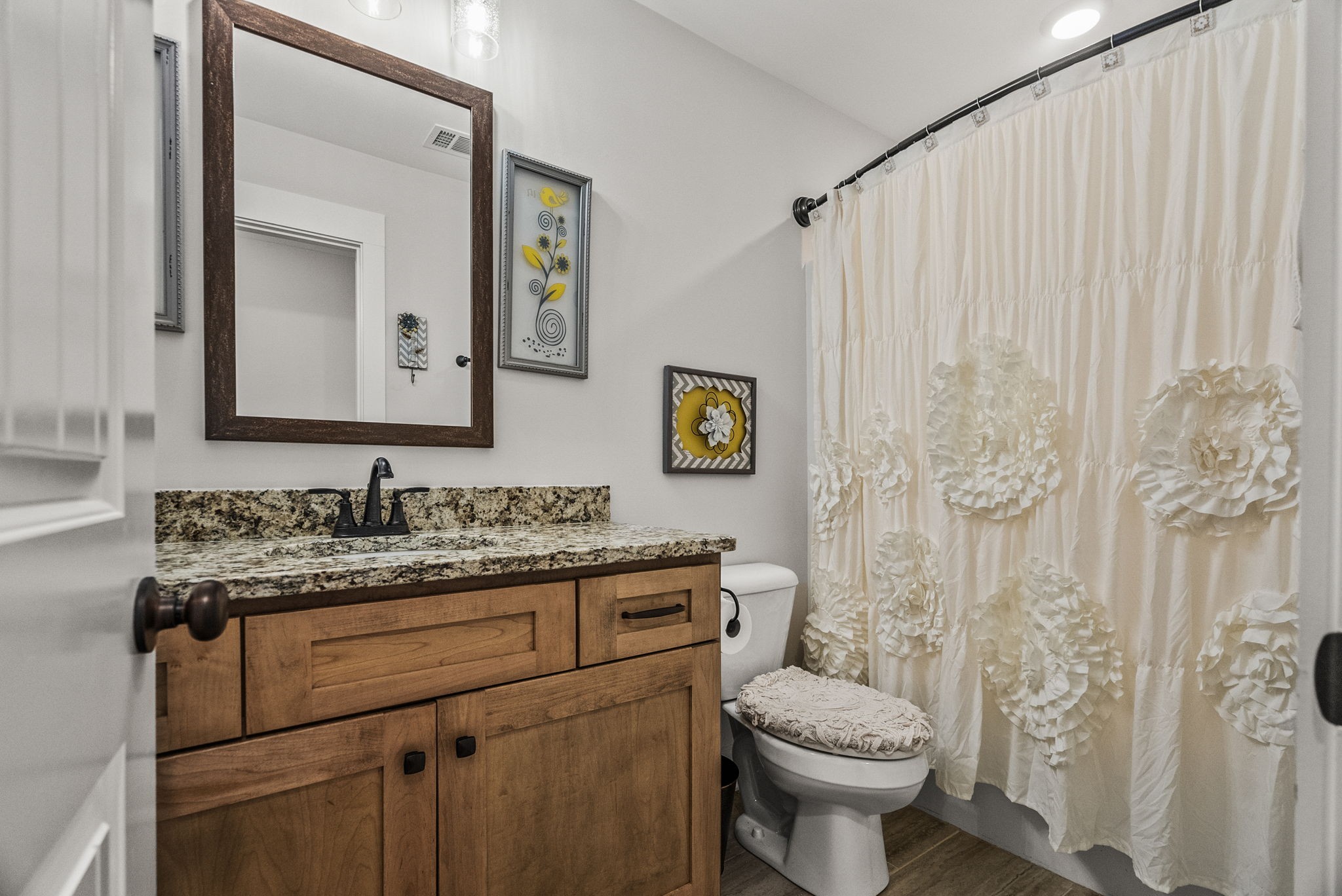 3378 New Hall Road Greenbrier, TN 37073 - Photo 56 of 83 a bathroom with a granite countertop toilet sink and mirror