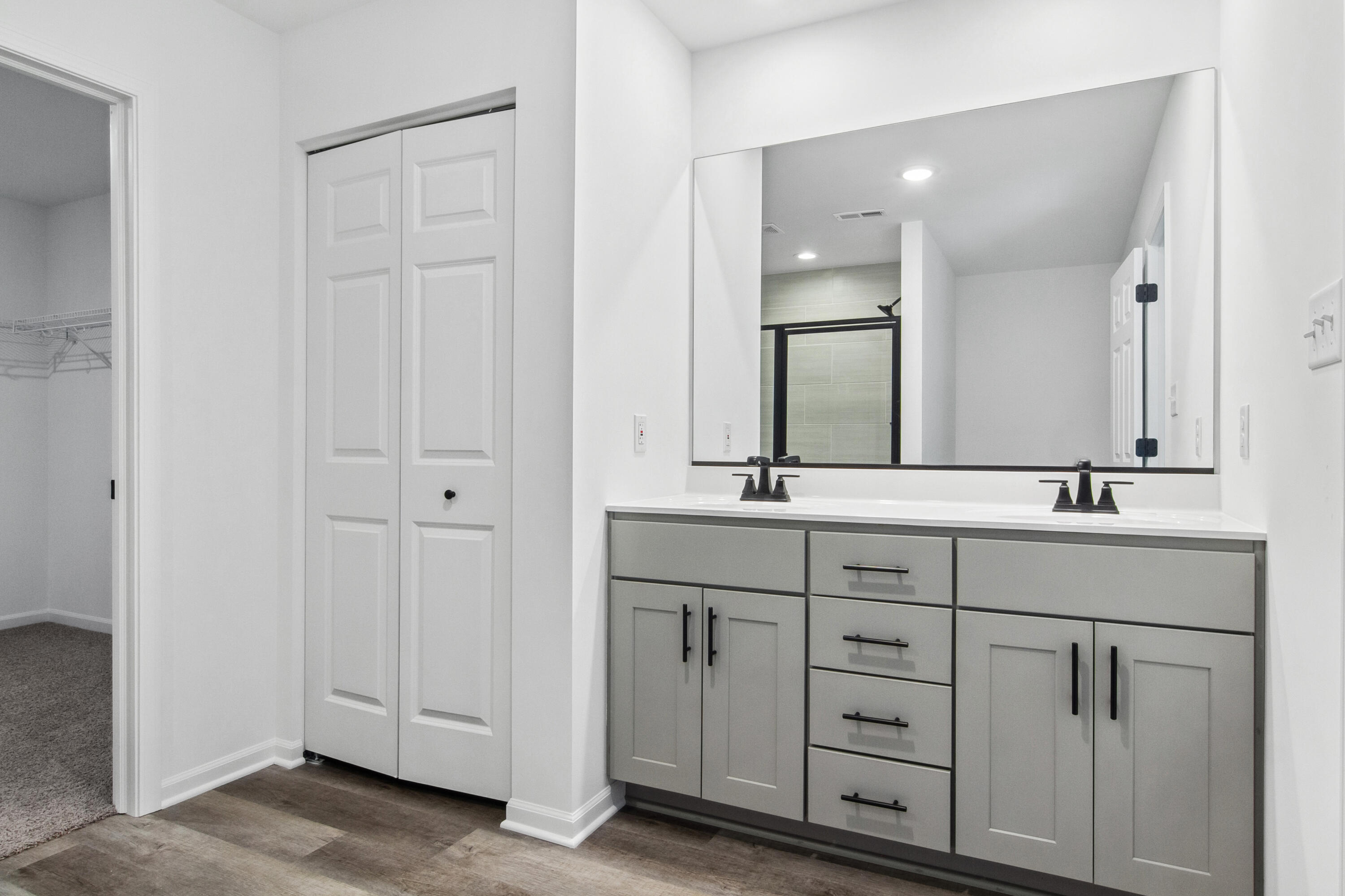 10340 California Street Crown Point, IN 46307 - Photo 14 of 22 a bathroom with a double vanity sink and a mirror