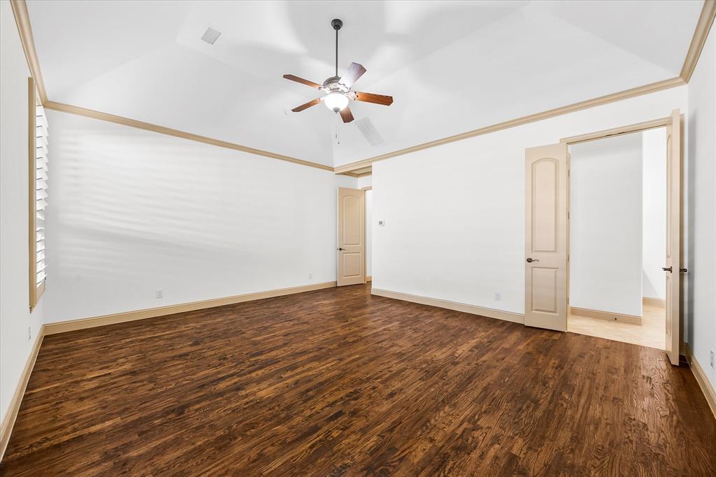 6814 Springwood Lane Garland, TX 75044 - Photo 21 of 35 wooden floor in an empty room with a window