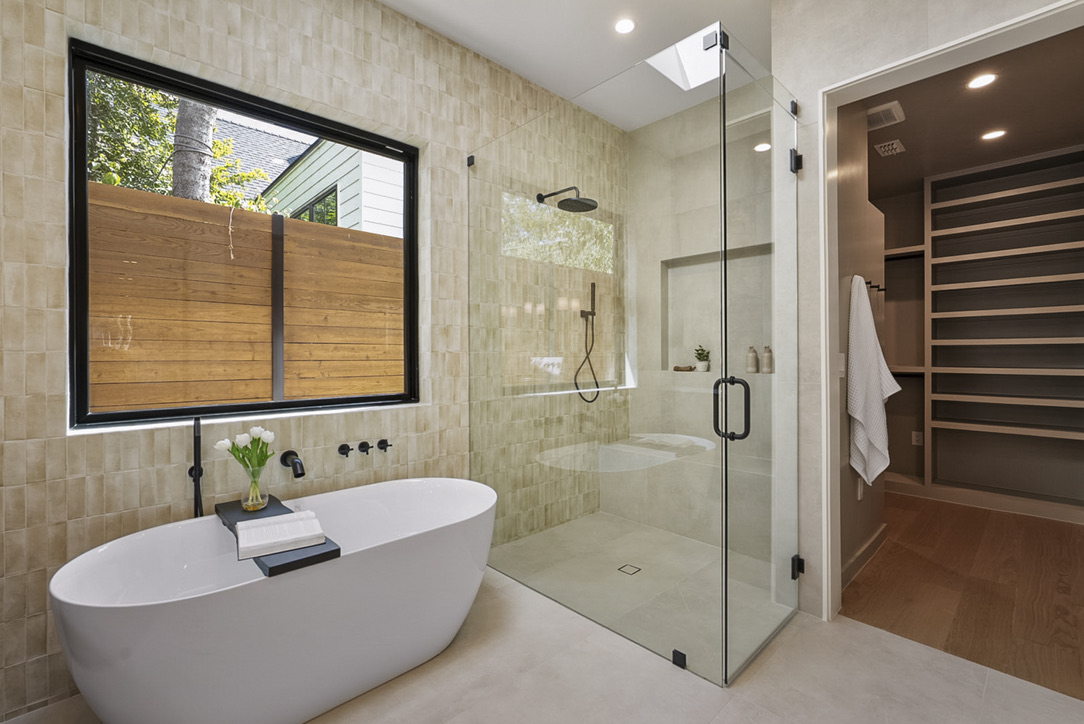 308 El Paso Street Austin, TX 78704 - Photo 21 of 38 a bathroom with a tub and a shower