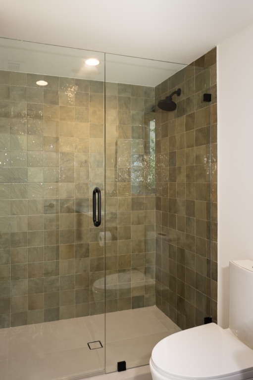 308 El Paso Street Austin, TX 78704 - Photo 35 of 38 a bathroom with a shower and a toilet