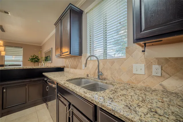 a kitchen with a sink and cabinets