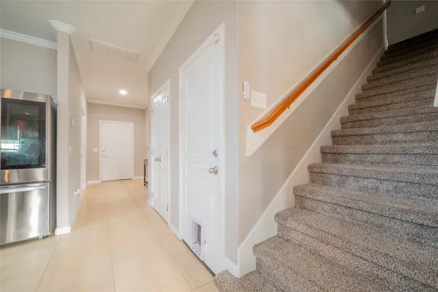 a view of a hallway with stairs