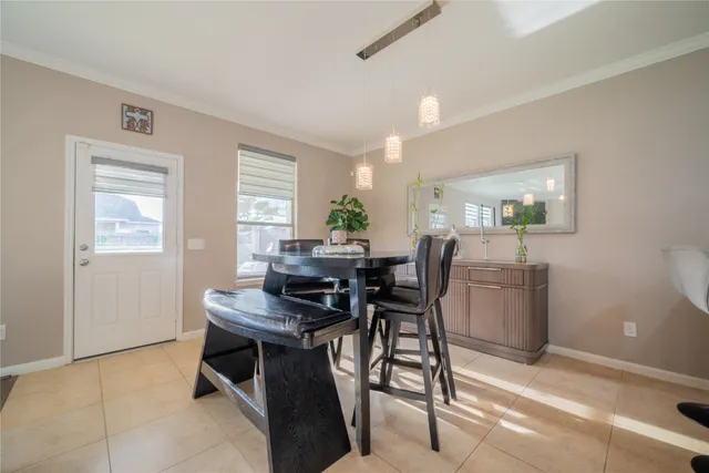 a view of a dining room with furniture and a window