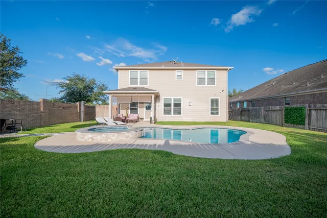 a view of a house with a yard porch and sitting area