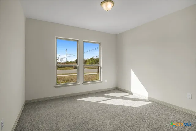 an empty room with a empty space and a window