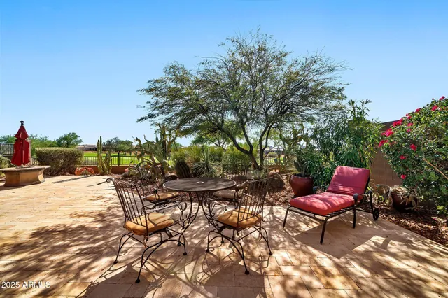 a view of a backyard with sitting area