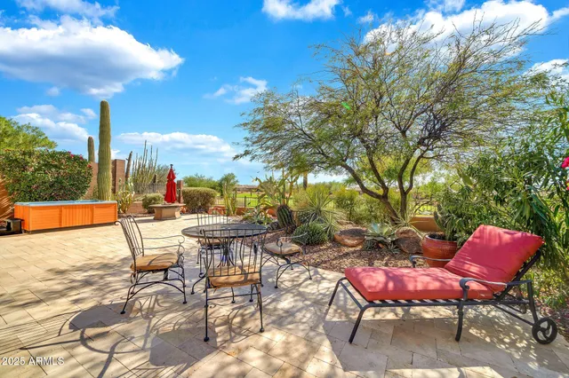 a view of a chairs and tables in the patio