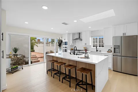 a kitchen with lots of counter top space and appliances