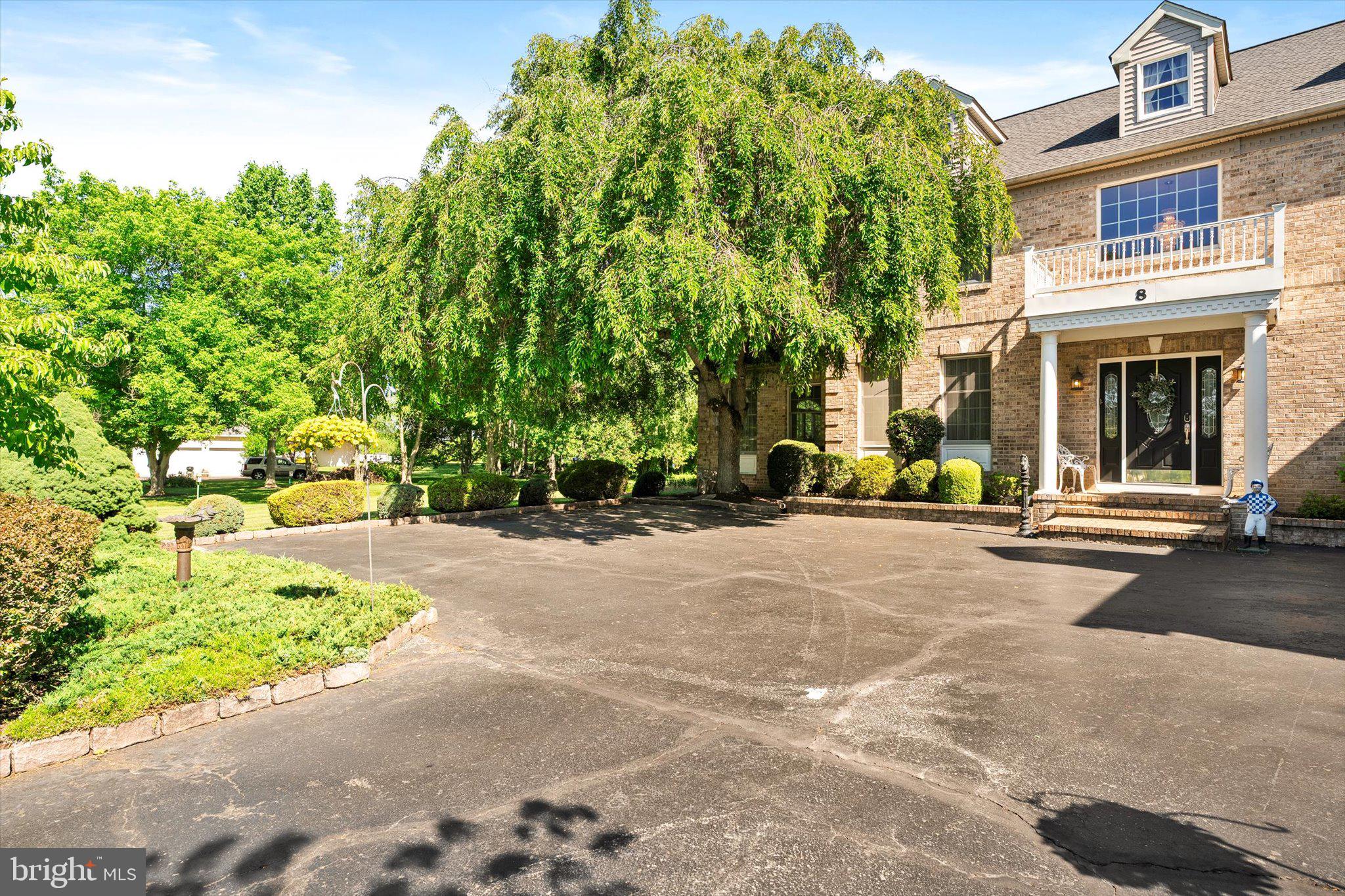 8 Carney Way Hamilton, NJ 08620 - Photo 5 of 66 Lush greenery surrounds a grand entrance.