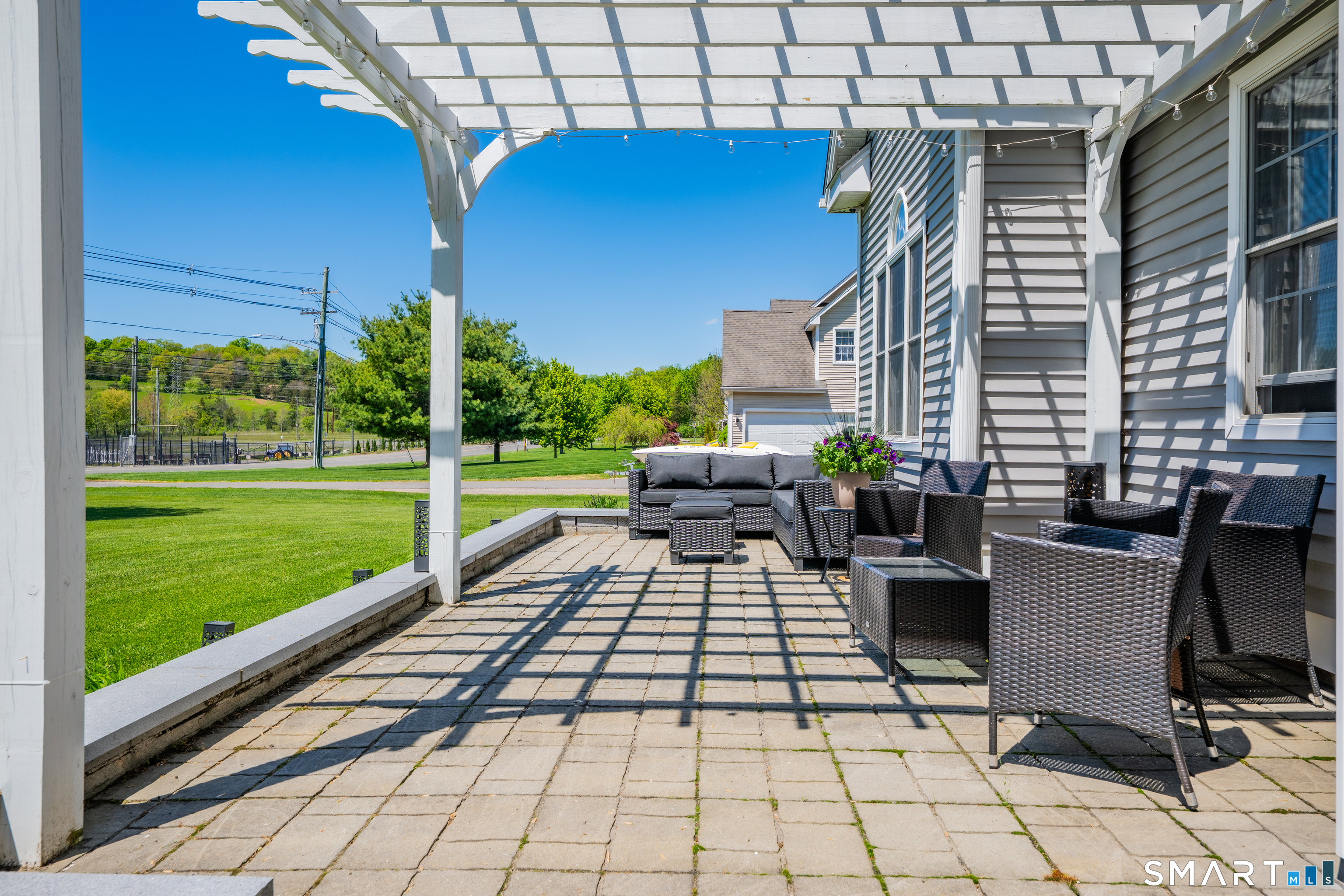 409 Beckley Road Berlin, CT 06037 - Photo 4 of 39 a view of a patio with a dining table and chairs