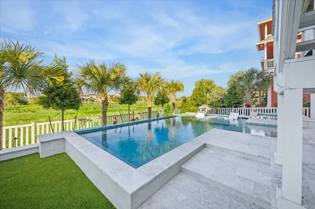 a view of a swimming pool with a patio