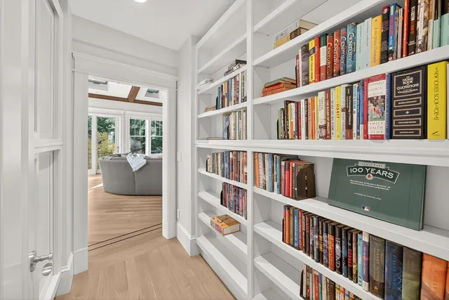 a living room with furniture and floor to ceiling windows
