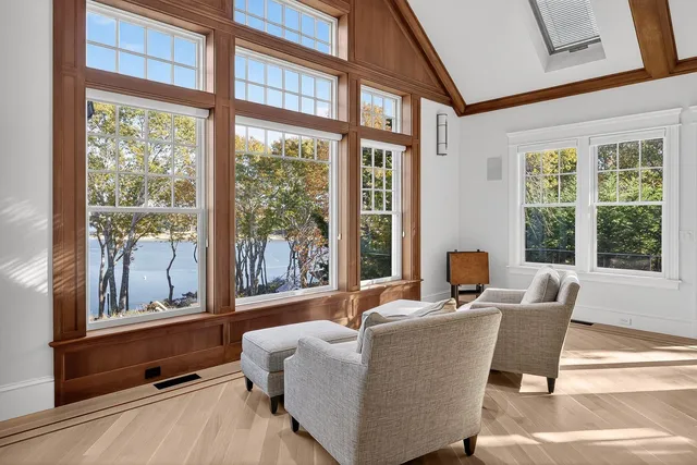 a bedroom with a large bed and a large window