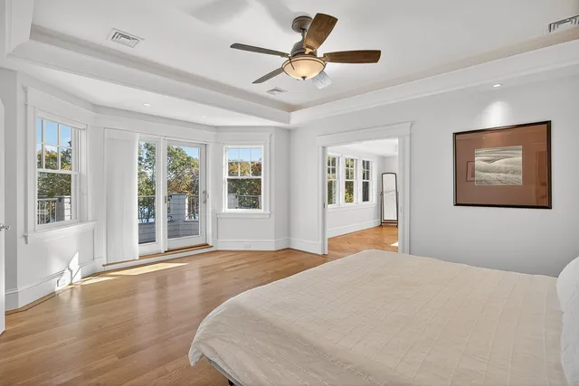 a bedroom with two beds and a window