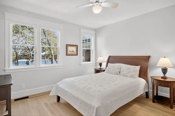 a bedroom with two beds and a window