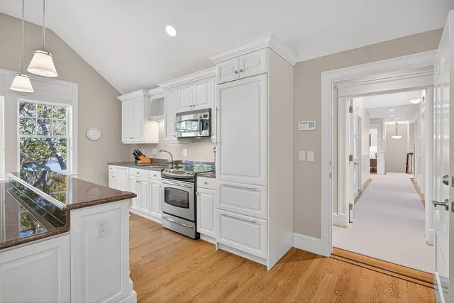 a living room with furniture and large windows