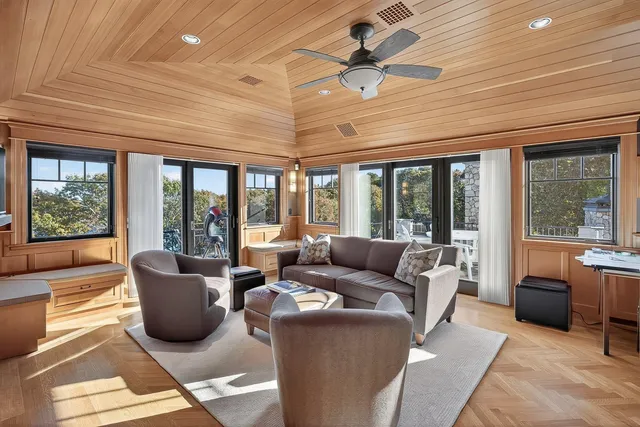 a front view of house with yard and trees around