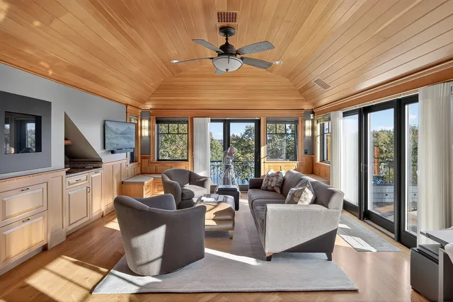 an aerial view of a house with a yard