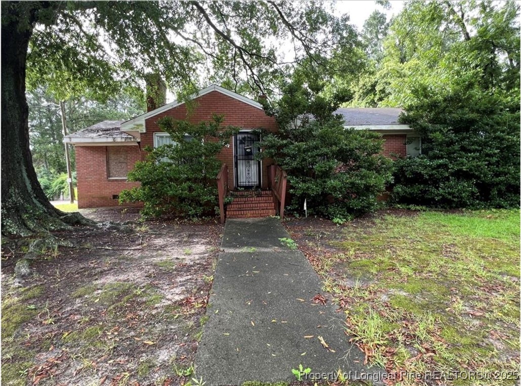 1009 Lodge Street South Wilson, NC 27893 - Photo 2 of 3 a view of a backyard with plants and patio