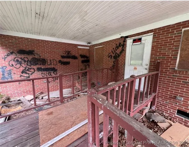 a view of a backyard with sitting area