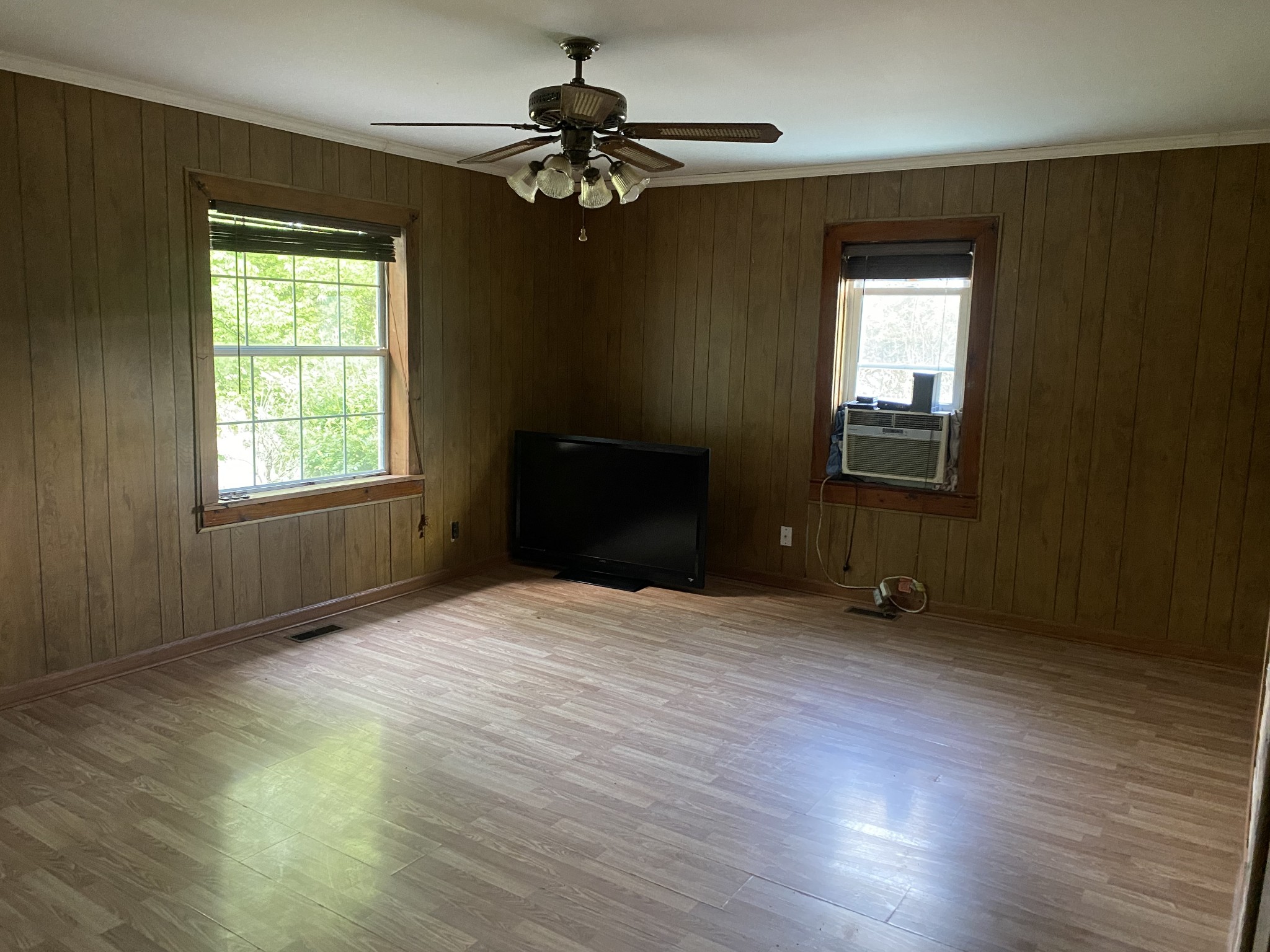 1025 Chandler Road Ashland City, TN 37015 - Photo 4 of 12 a view of an empty room with a window and wooden floor