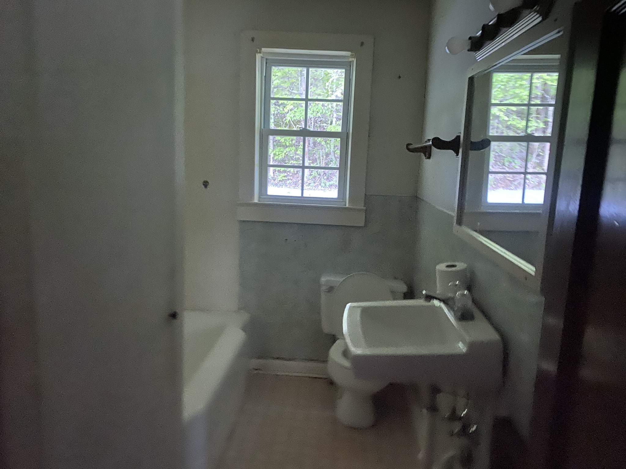 1025 Chandler Road Ashland City, TN 37015 - Photo 7 of 12 a bathroom with a sink a toilet and a window