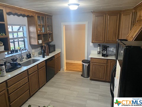 319 West Village Road Salado, TX 76571 - Photo 13 of 24 a kitchen with a sink cabinets and wooden floor