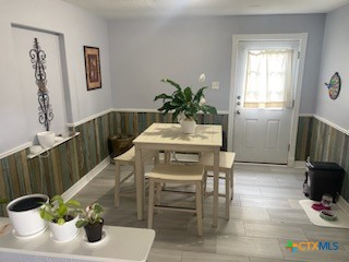 319 West Village Road Salado, TX 76571 - Photo 10 of 24 a dining room with furniture and wooden floor