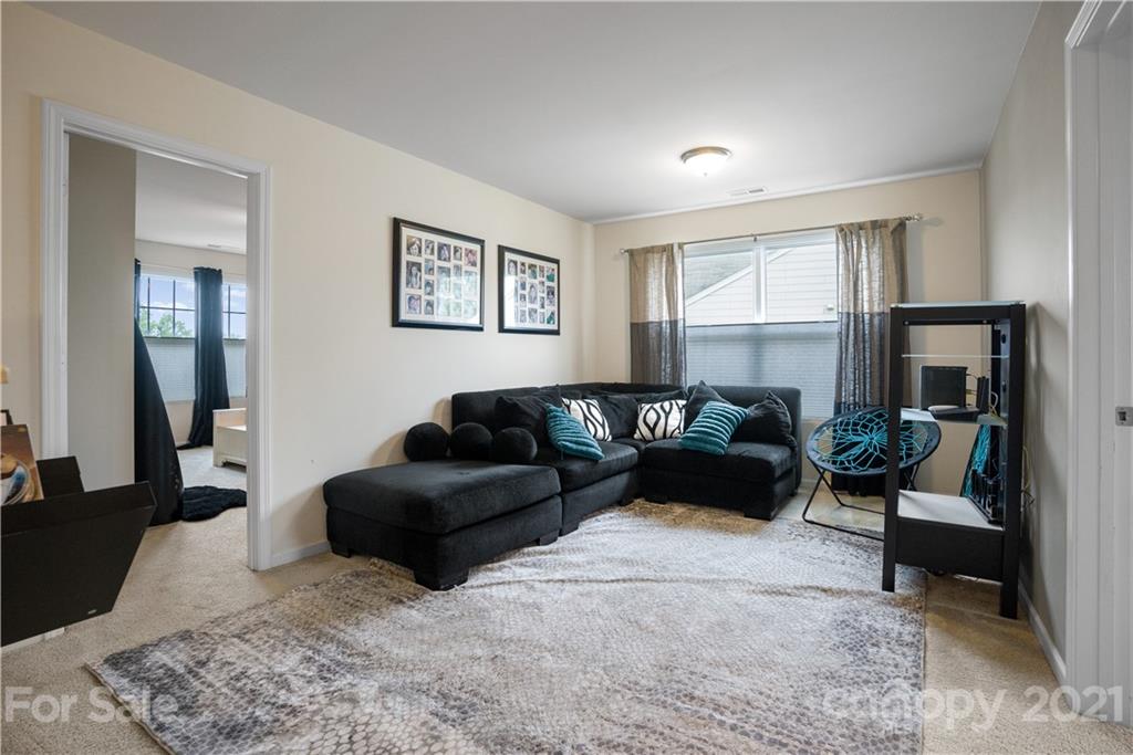 2714 Aldergrove Road Matthews, NC 28105 - Photo 13 of 23 a living room with furniture and a couch