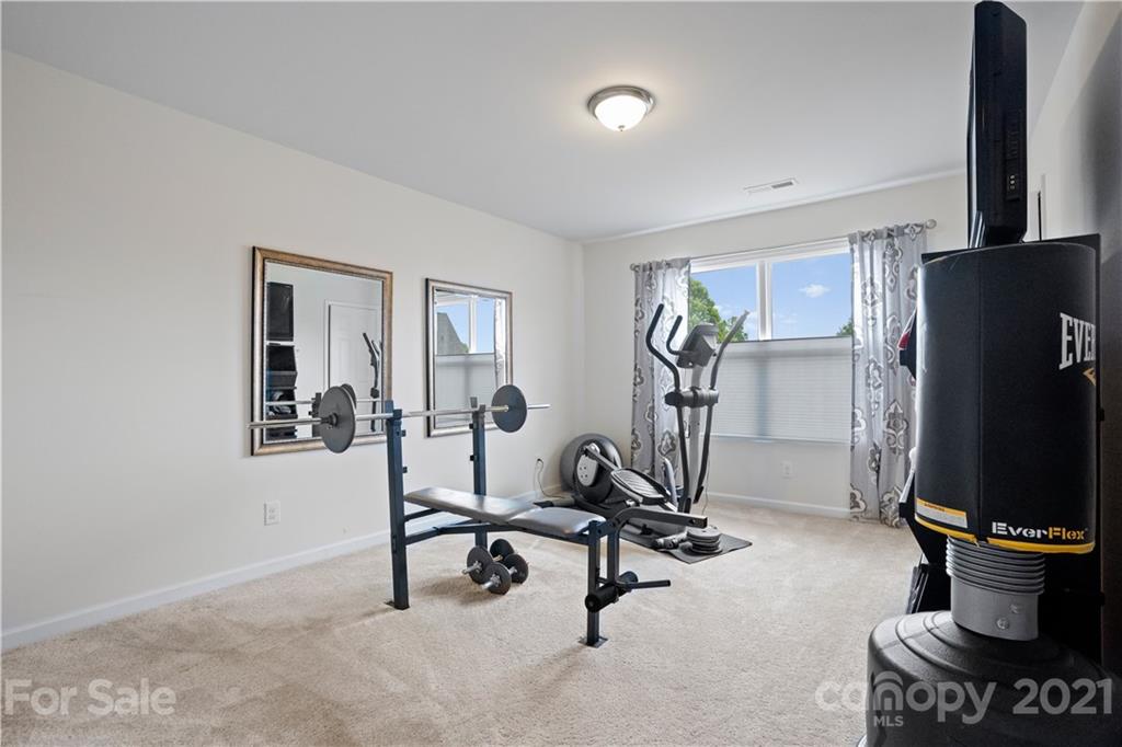 2714 Aldergrove Road Matthews, NC 28105 - Photo 14 of 23 a view of a room with gym equipment