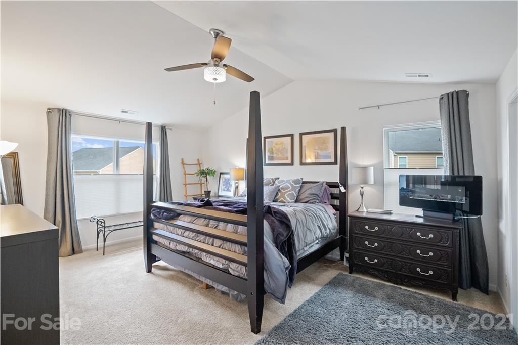 2714 Aldergrove Road Matthews, NC 28105 - Photo 19 of 23 a bedroom with a bed and wooden floor