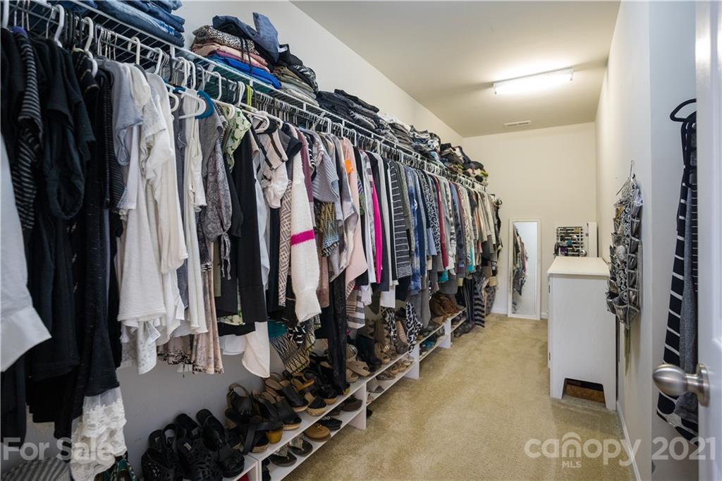2714 Aldergrove Road Matthews, NC 28105 - Photo 22 of 23 a view of walk in closet with clothes