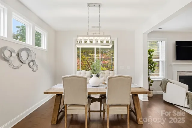 a dining room with furniture and window
