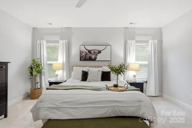 a large white bathroom with a sink shower and a bathtub