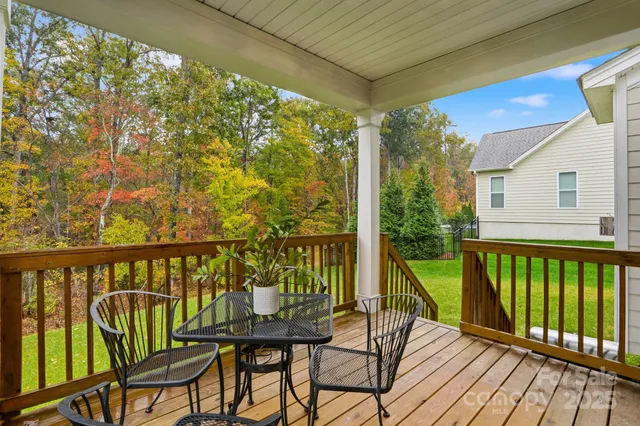 a view of a chair and table in the balcony