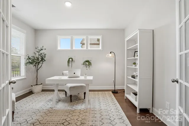 a dining room with a table and chairs