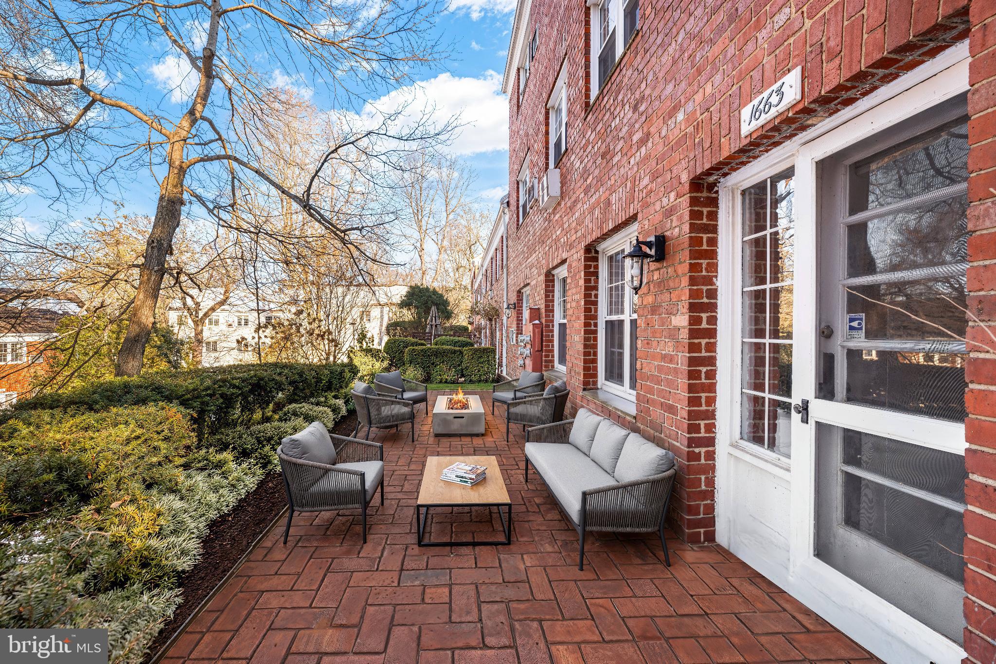 1663 Fitzgerald Lane Alexandria, VA 22302 - Photo 2 of 9 a view of a patio with couches table and chairs and potted plants