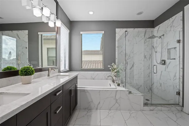 a bathroom with a granite countertop sink a toilet and a mirror