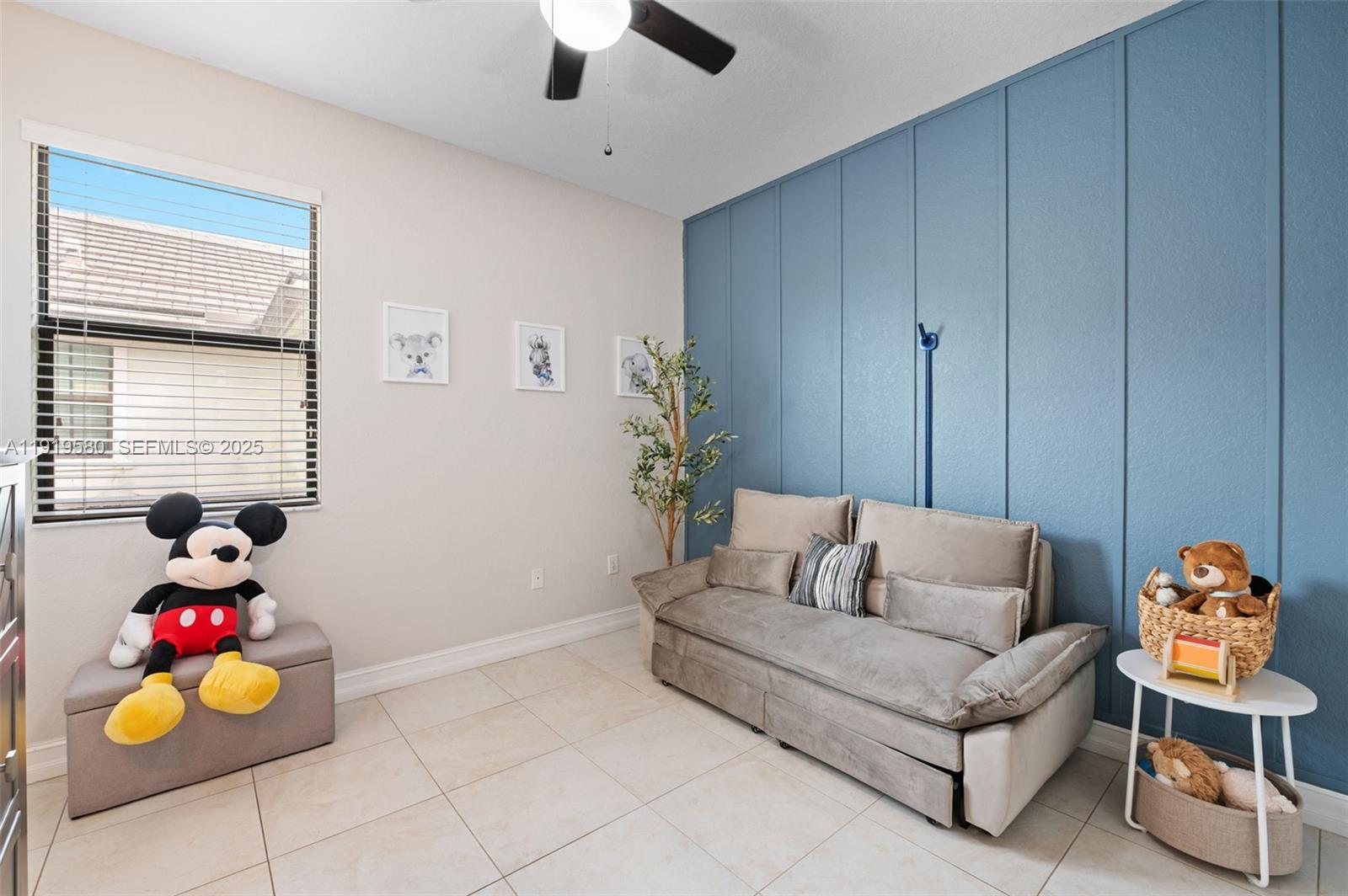 445 Southwest 113th Lane Pembroke Pines, FL 33025 - Photo 14 of 26 a living room with furniture and a window