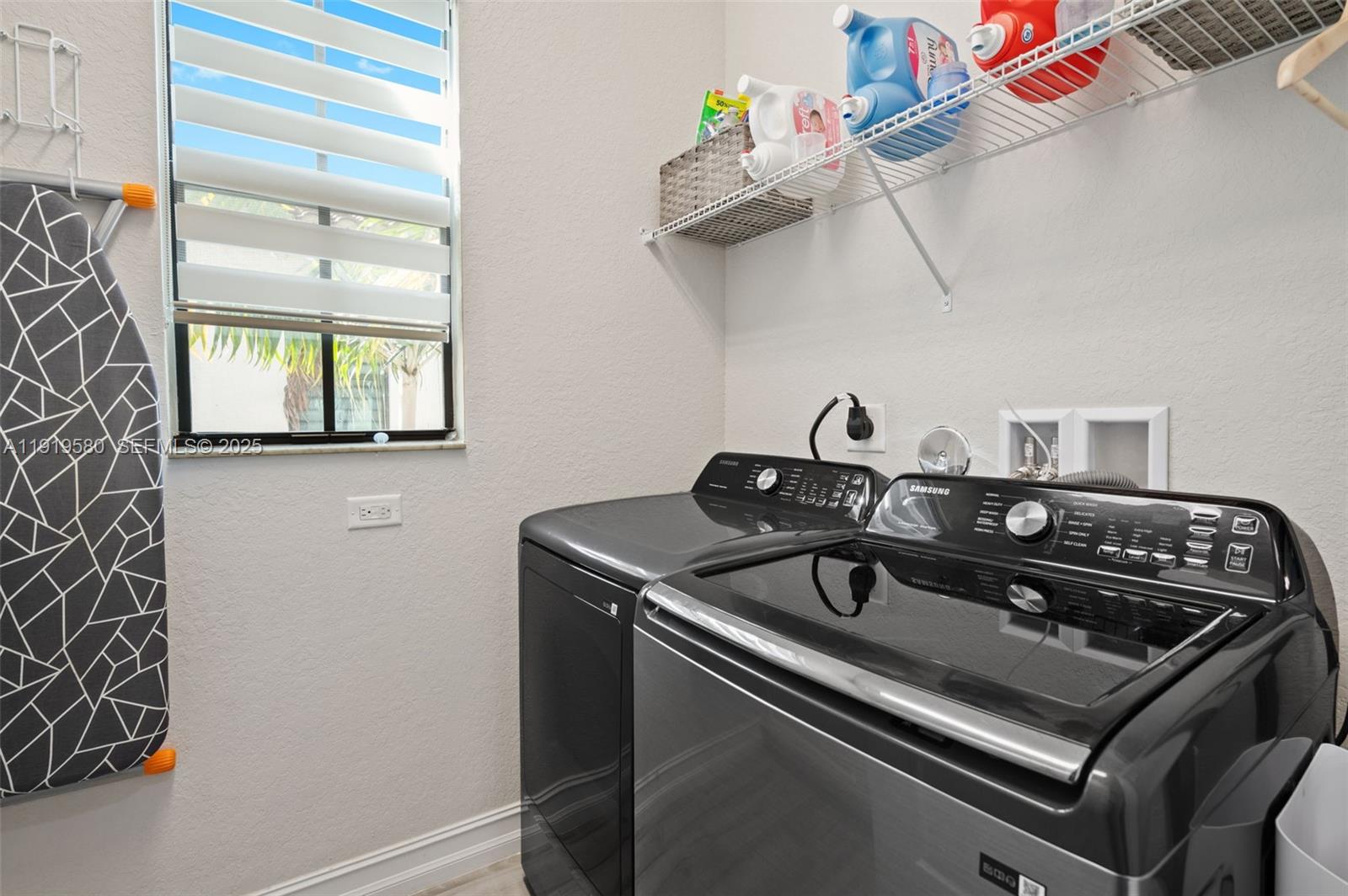 445 Southwest 113th Lane Pembroke Pines, FL 33025 - Photo 20 of 26 a close view of a sink a counter and appliances in a room