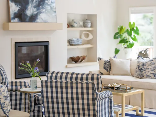 a living room with furniture lamp and rug