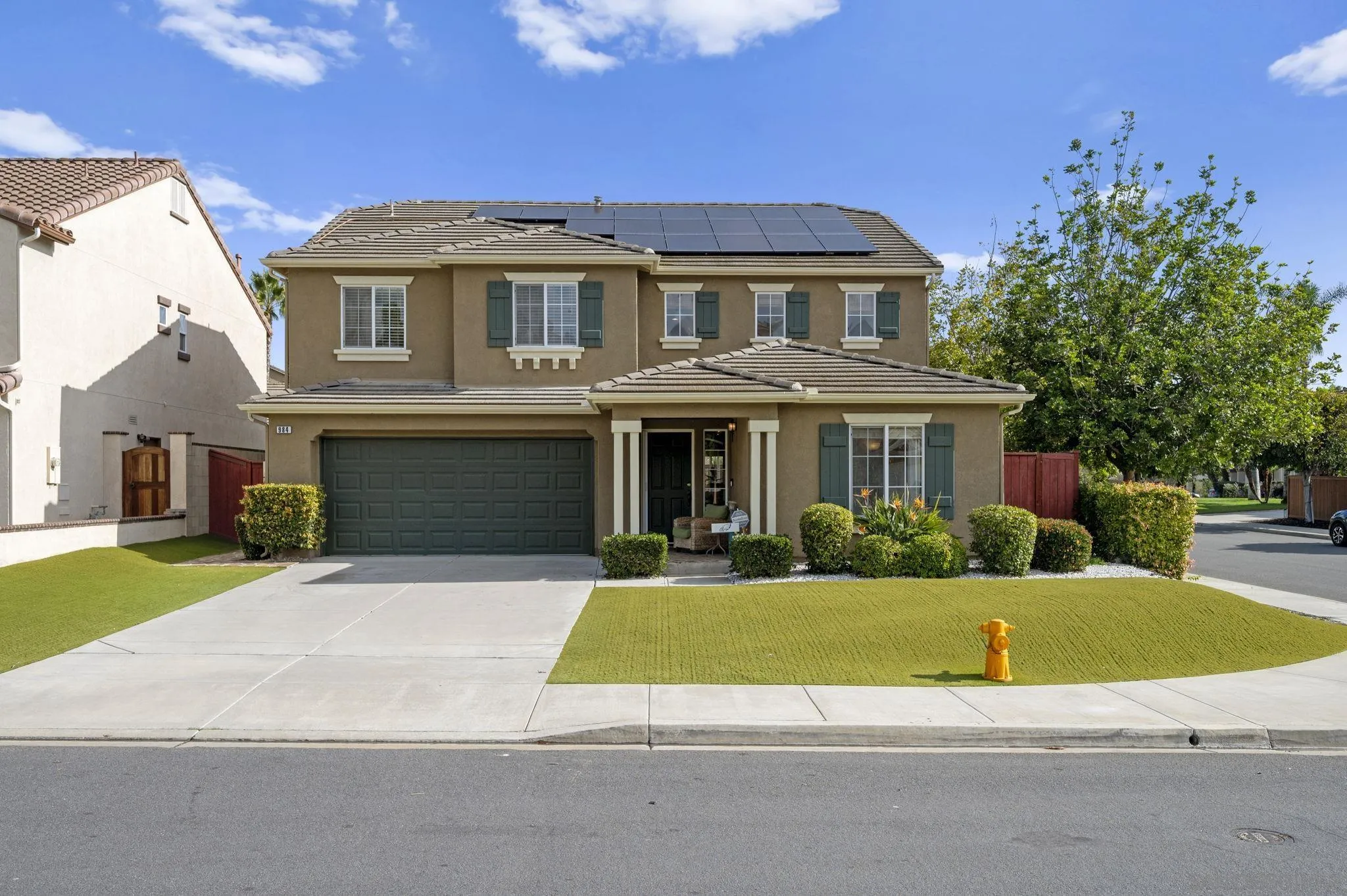 a view of house with outdoor space and swimming pool