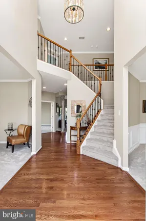 a view of livingroom with dining room and hall with wooden floor